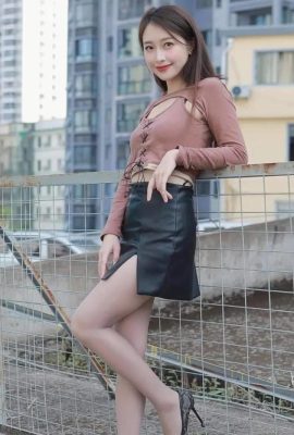 Beauty in leather skirt and stockings